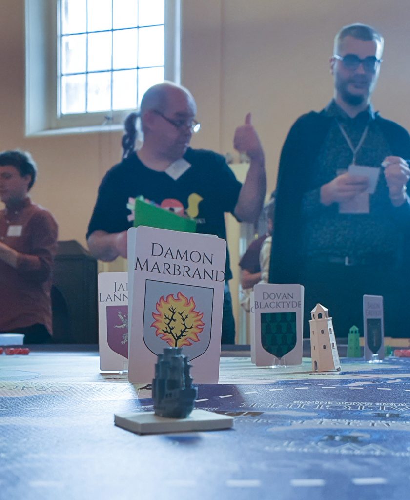 Damon Marbrand's character marker on the map at Everybody Dies 4. In the background, a Facilitator gives a thumbs up.