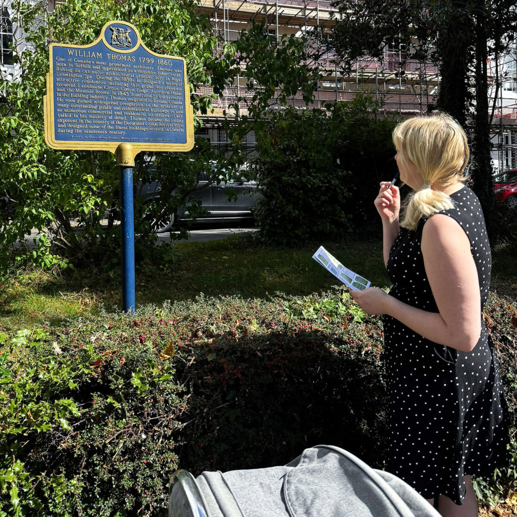 Becky looking thoughtfully at a sign